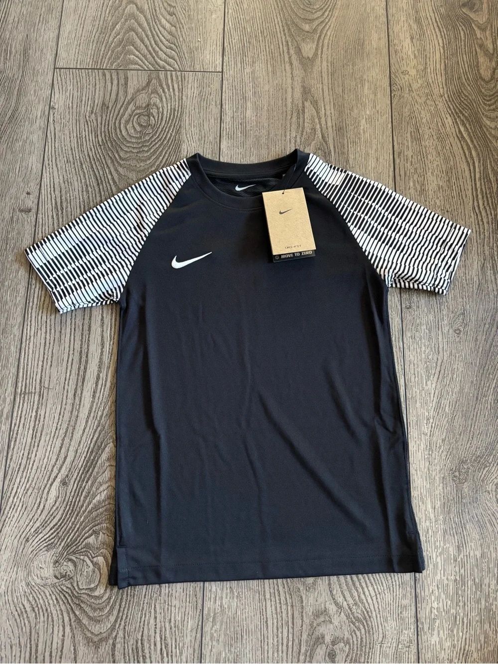 Nike Kids Black Athletic Tee with White Striped Raglan Sleeves